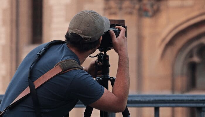 a professional photographer preparing to shoot a house's exterior