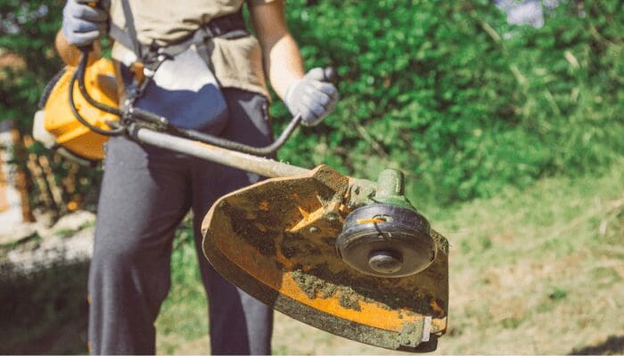 A person creating front yard curb appeal with an edger.